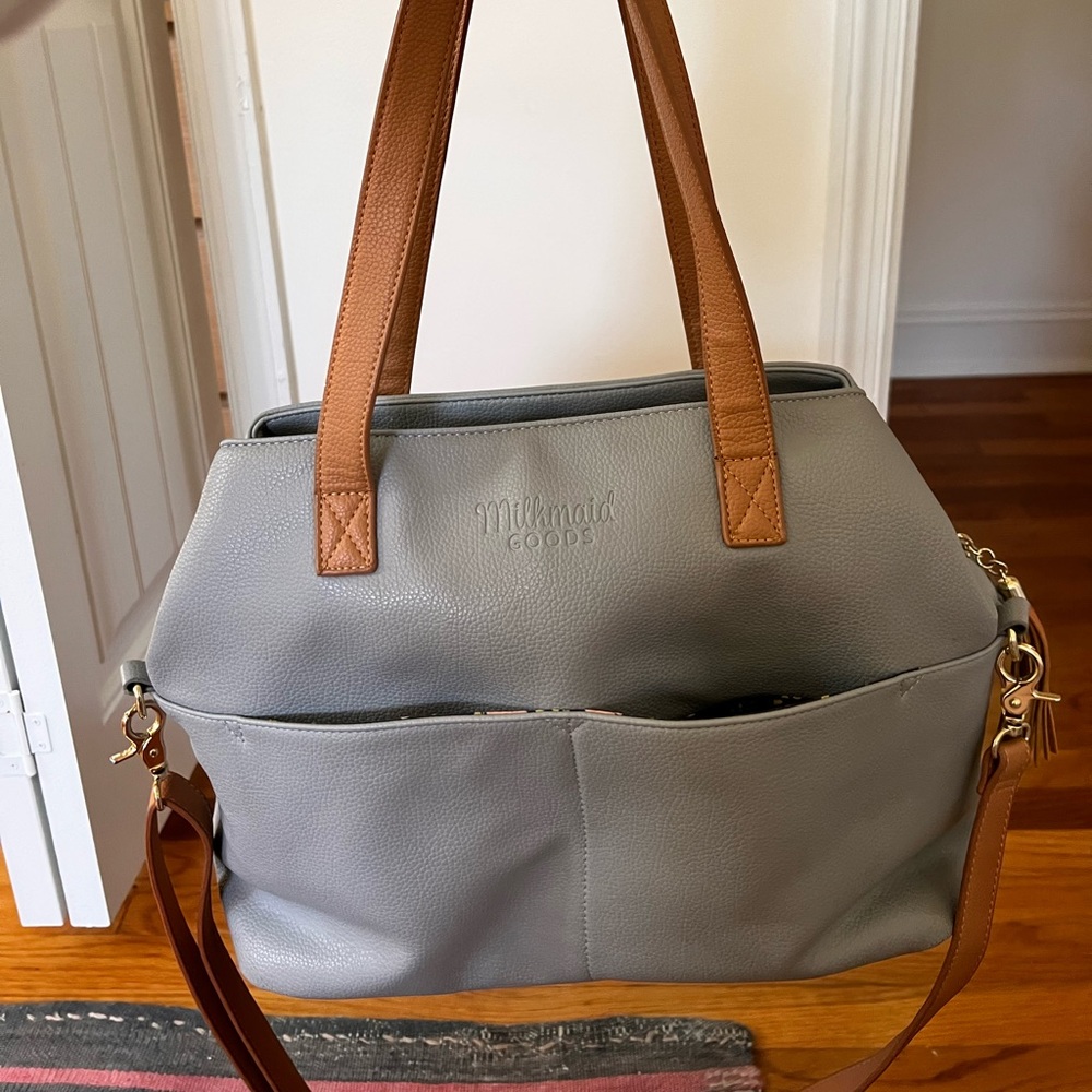 Milkmaid Goods gray leather diaper bag with matching changing pad